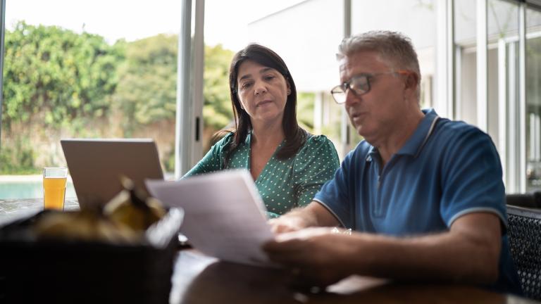 Older couple looking at documents